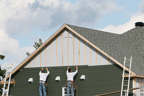 Professional Storm Damage Siding Repair technician working in Mount Airy, GA